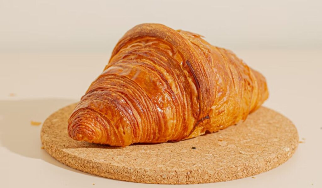Croissant on top of a cork coaster