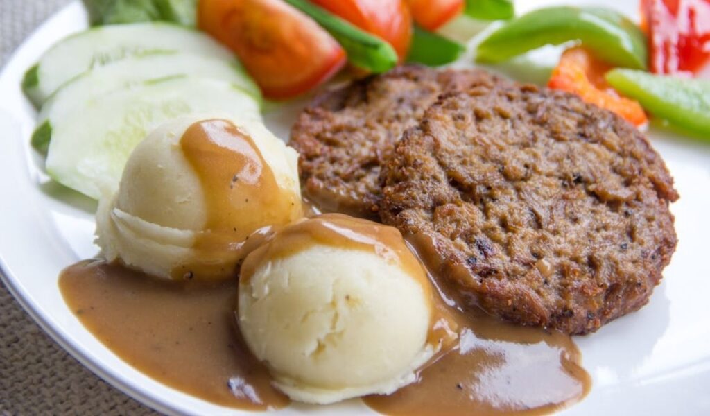 Close-up shot of mashed potatoes and gravy