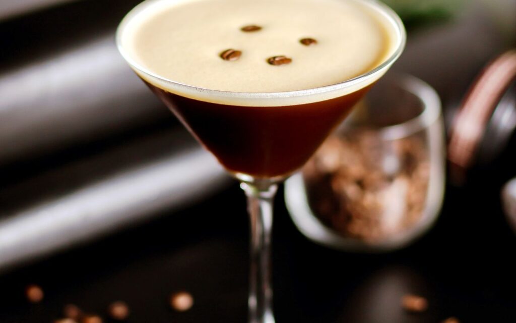 Espresso martini with creamy foam and coffee bean garnish