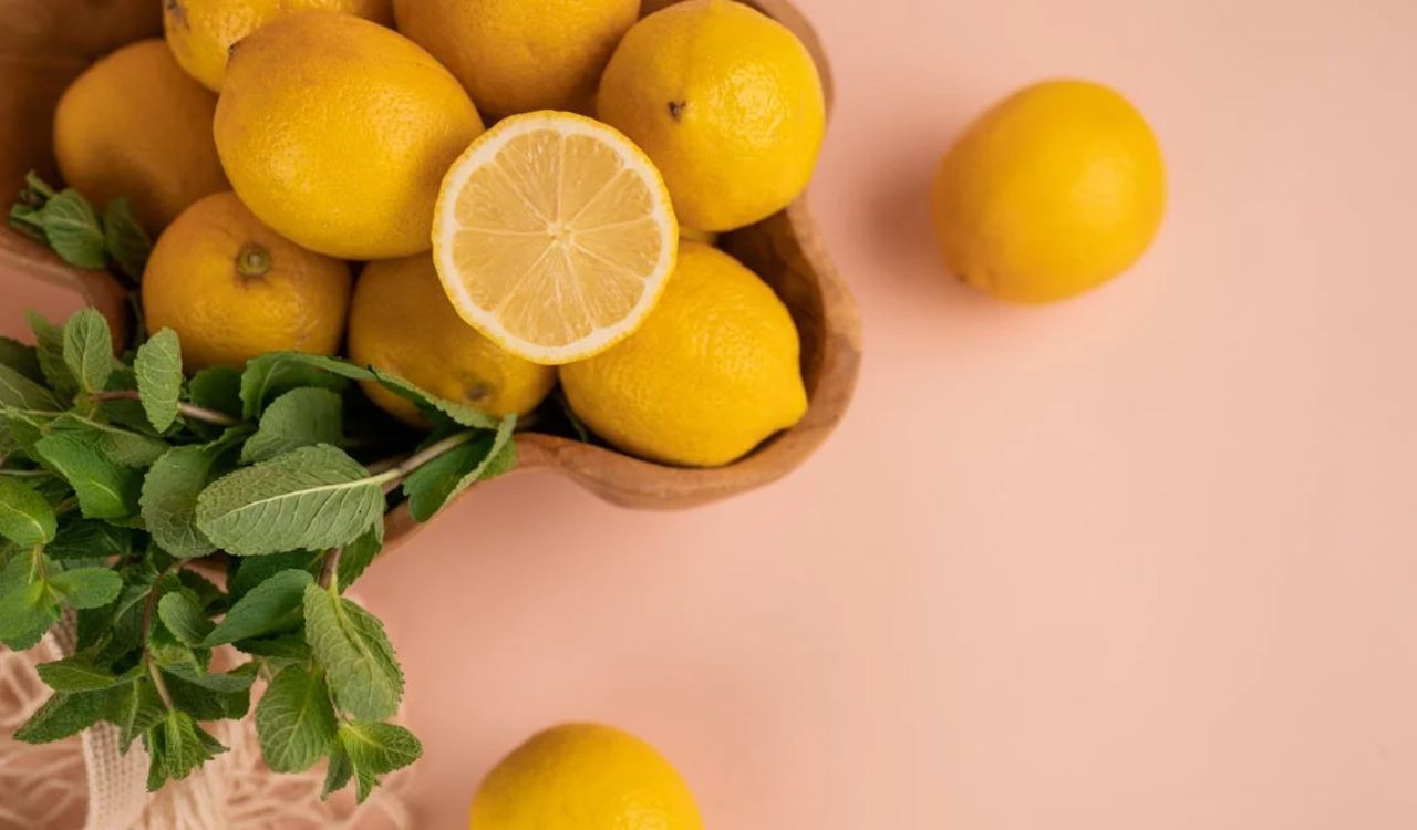 Fresh lemons and mint sprigs