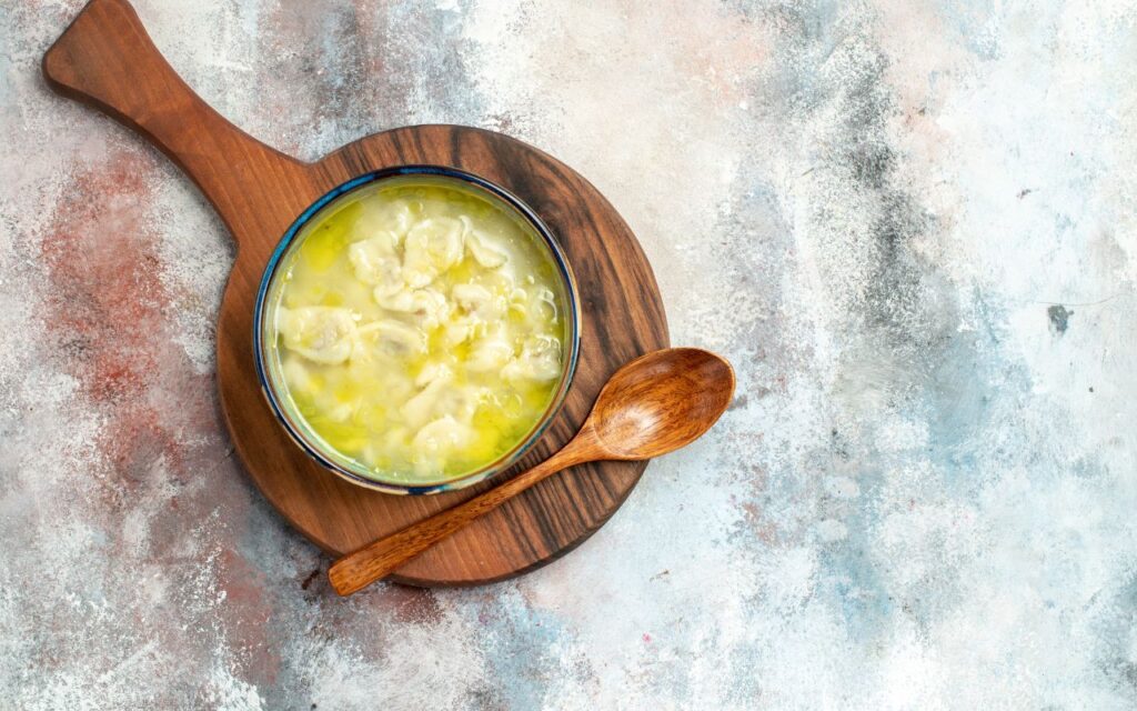 Bowl of garlic butter with wooden spoon
