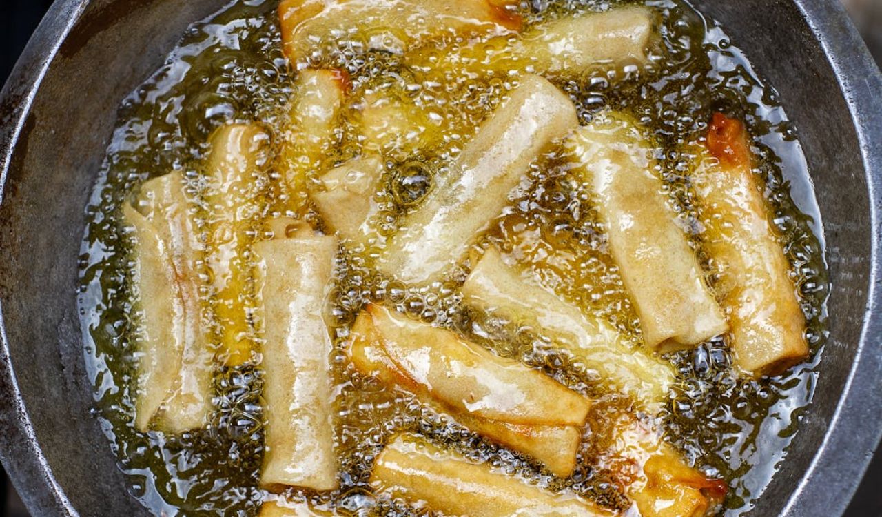 Golden Spring Rolls Frying in Hot Oil
