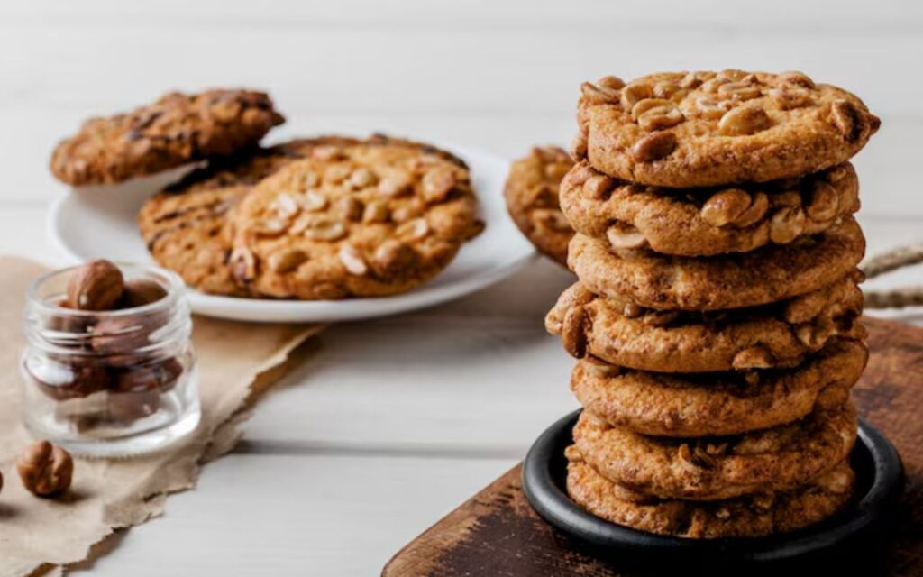 Stack of peanut cookies on a wooden board