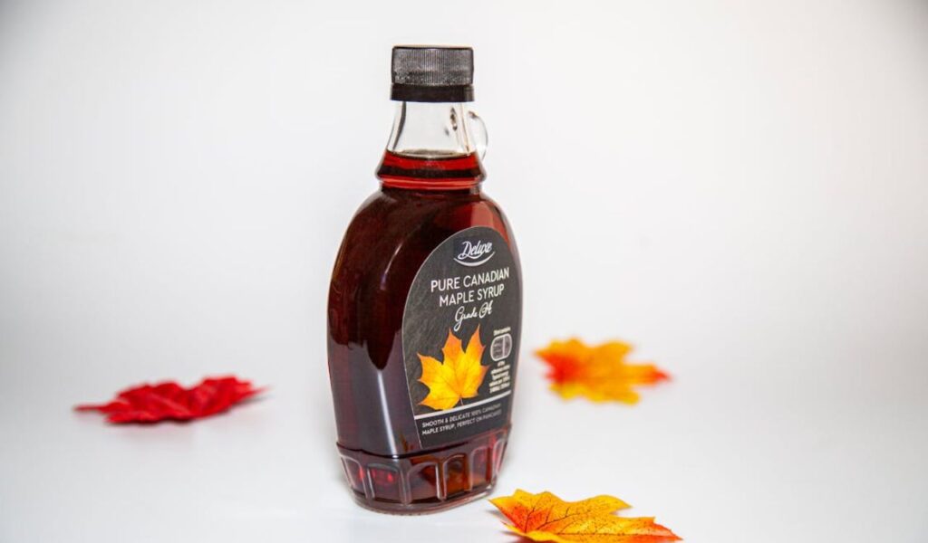 Maple Leaves around Maple Syrup Bottle