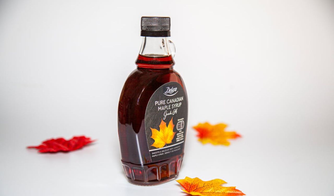 Maple Leaves around Maple Syrup Bottle