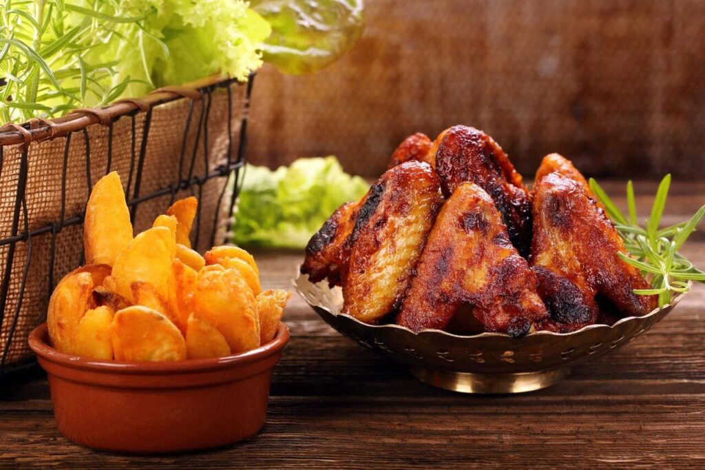 Chicken hot wings with baked potatoes