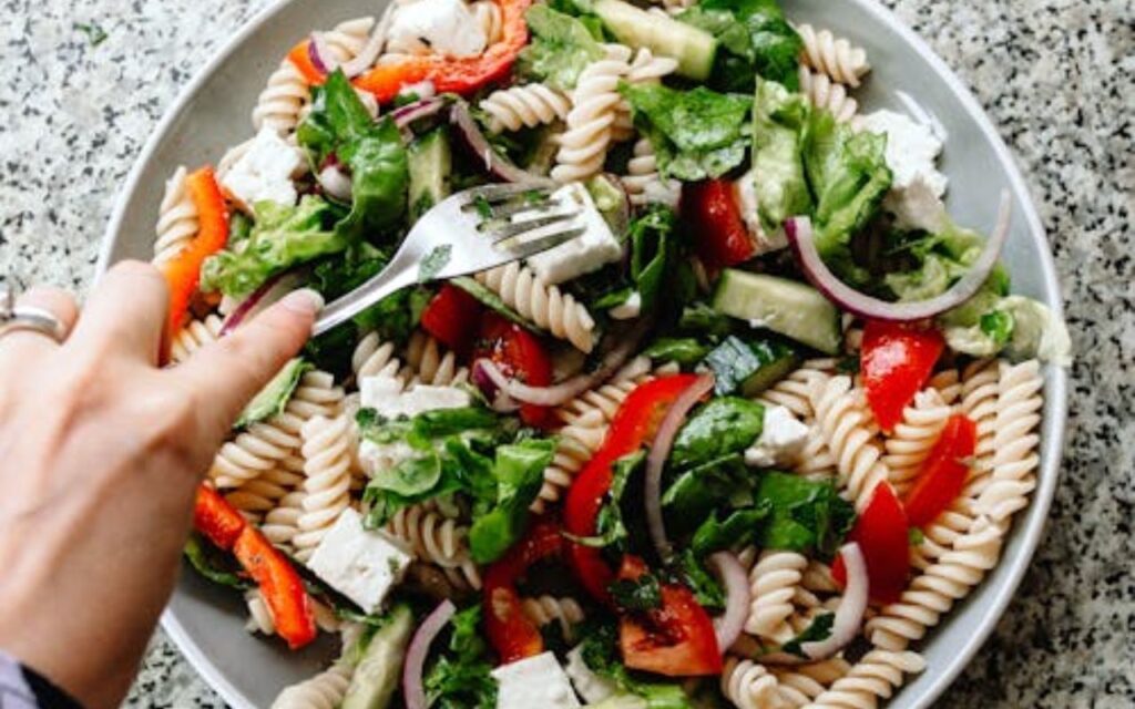 Mediterranean pasta salad with rotini, feta, and veggies