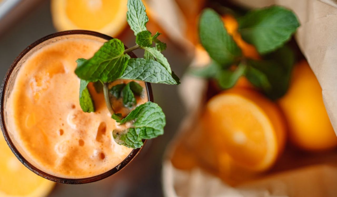Mint Leaves in Orange Juice in a Glass