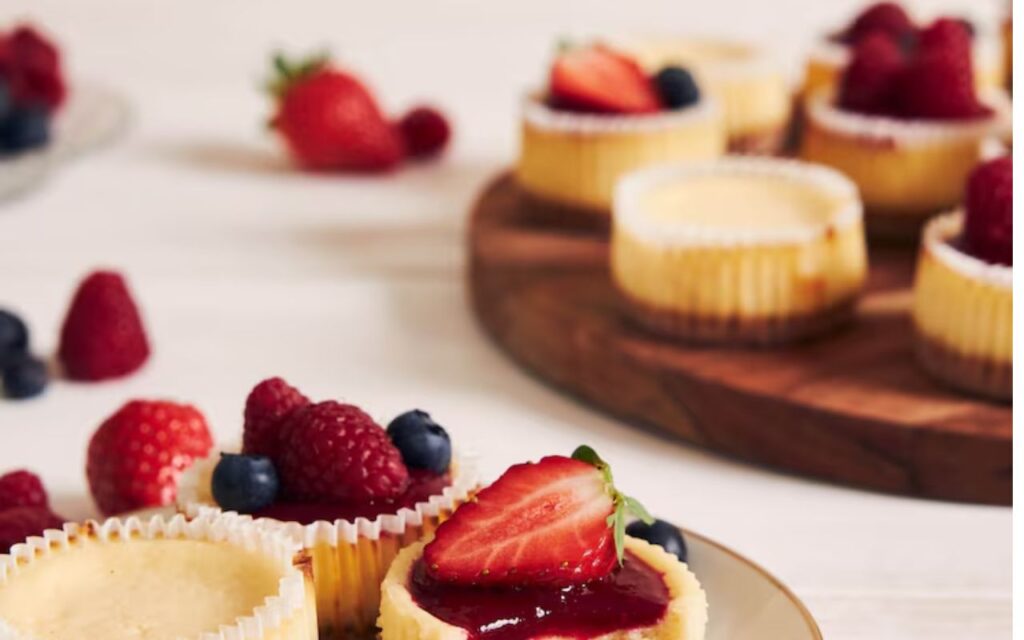 Mini cheesecakes topped with fresh berries