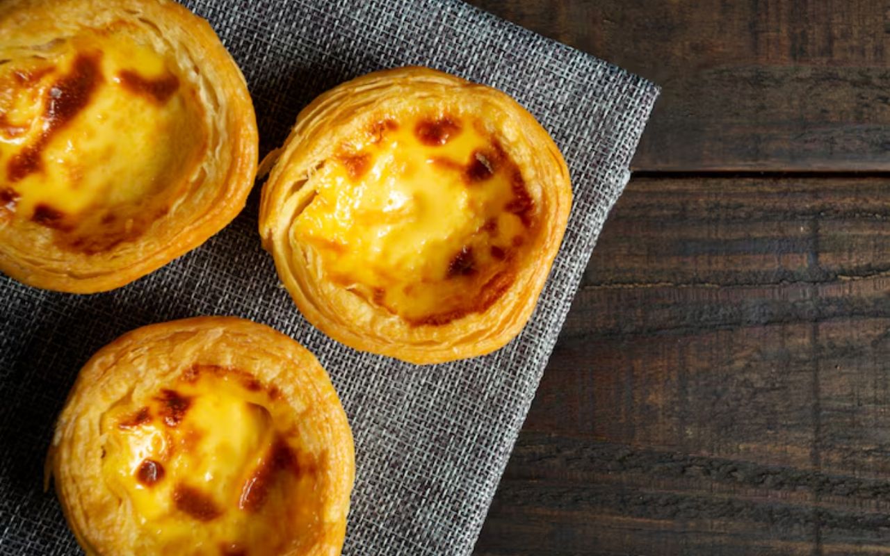 Pastel de nata custard tarts on a cloth napkin