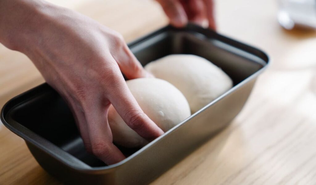 Person Holding a Dough