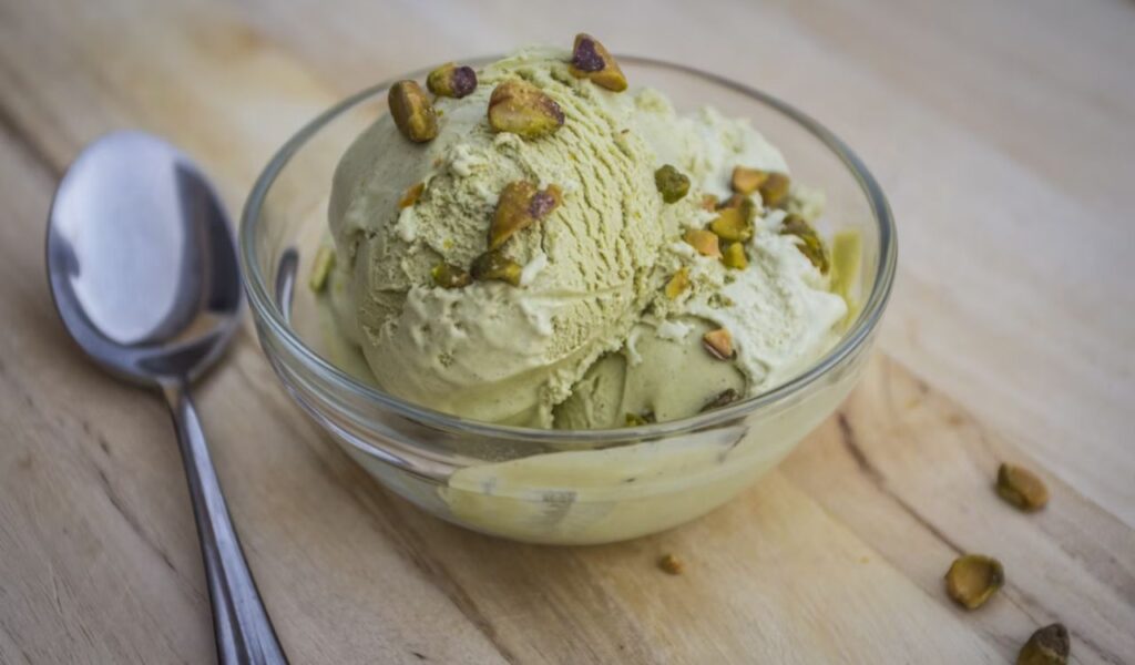 Pistachio icecream in clear glass bowl