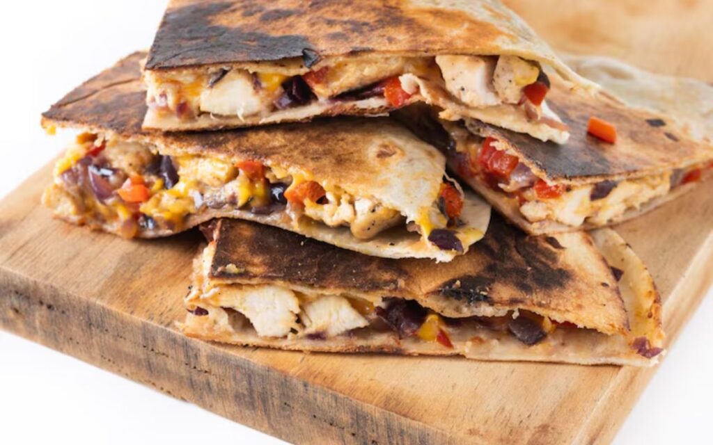 Stack of cheesy chicken quesadillas