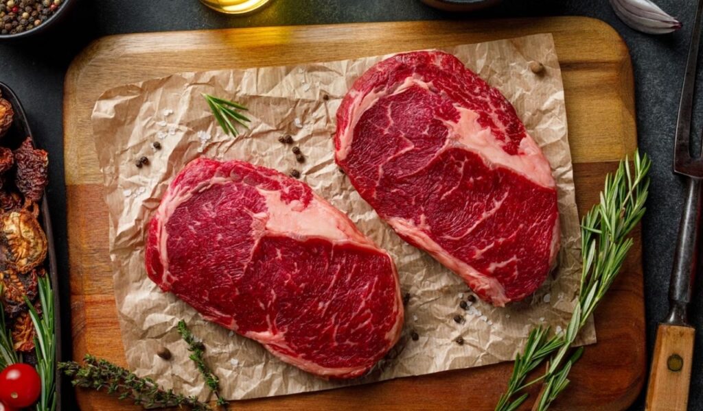 Raw fillet pork or beef steak pieces closeup top view