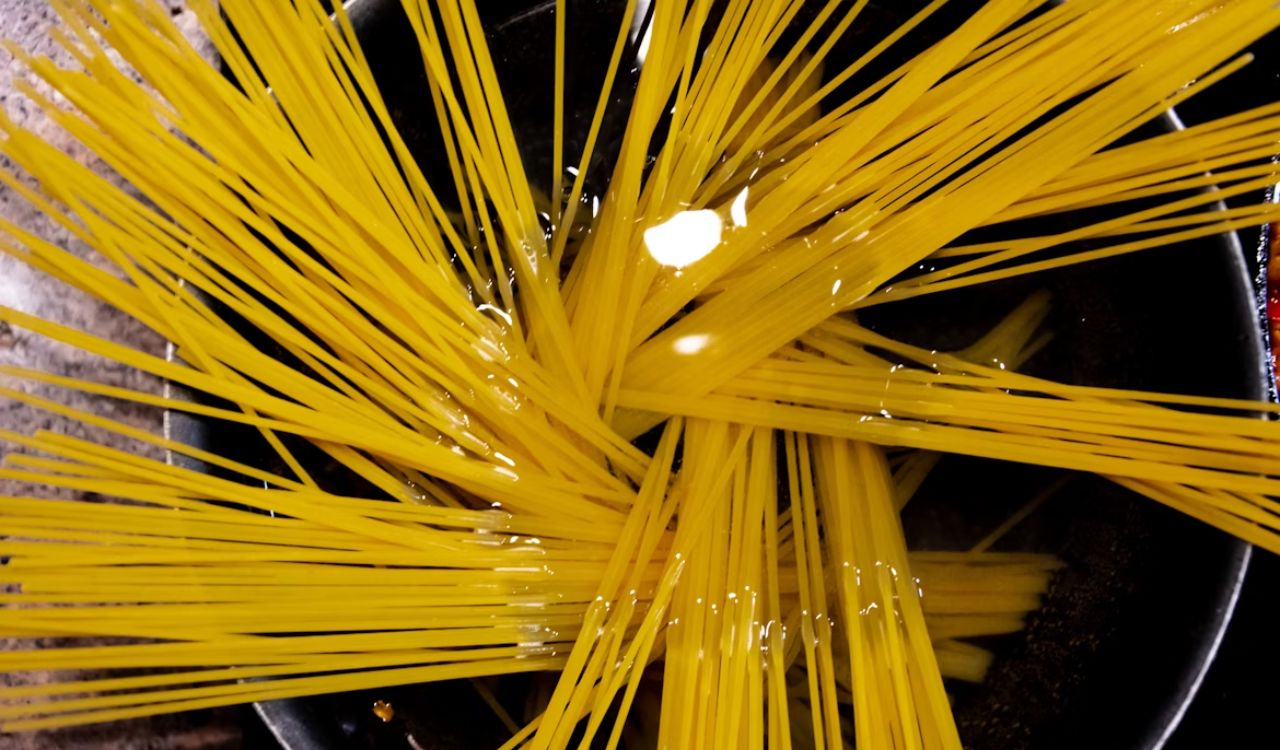 Raw pasta in pot