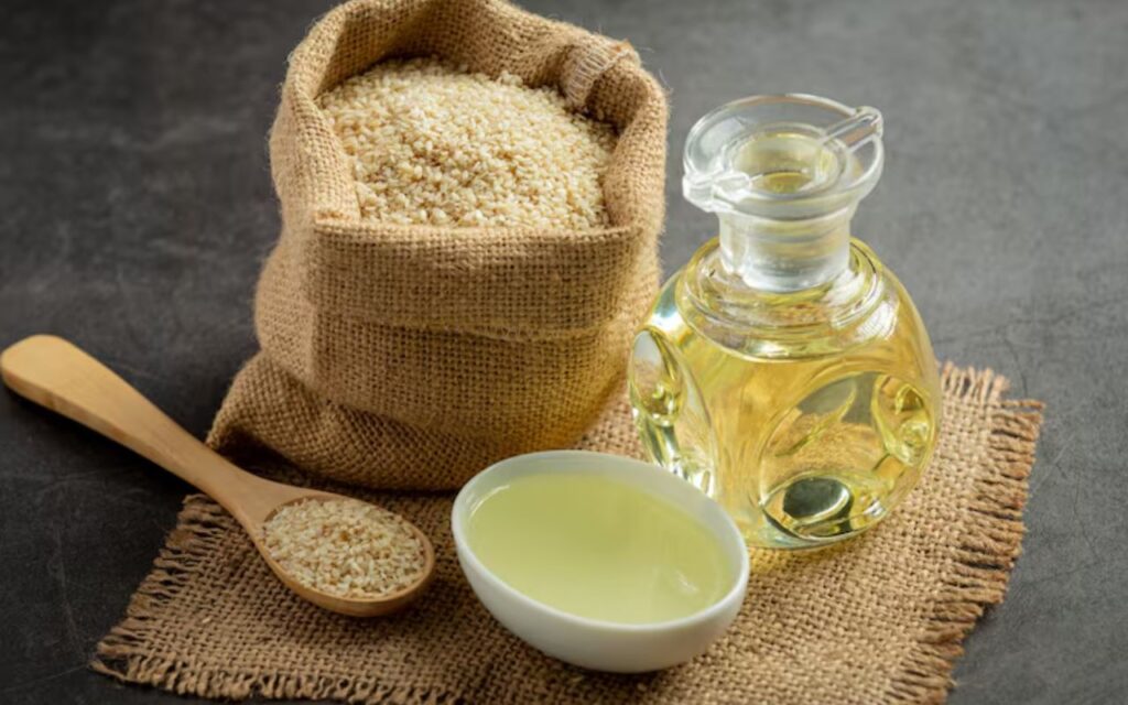 Sesame seeds and sesame oil in containers