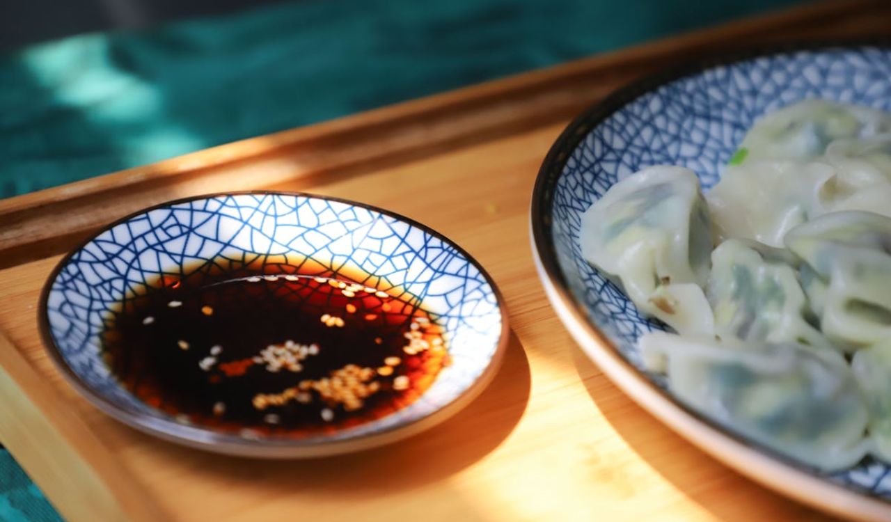 Round Blue Saucer Filled With Soy Sauce