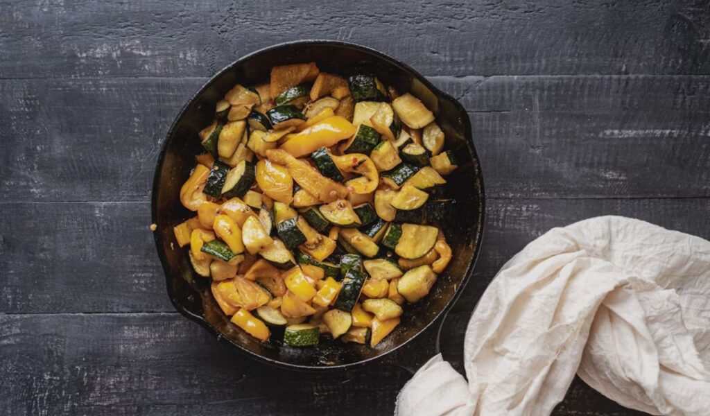 Sliced vegetables on cast iron