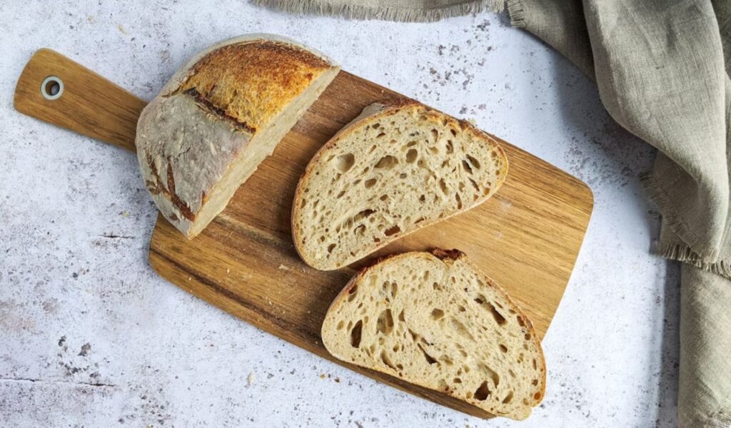 Sourdough bread on wooden chopping board