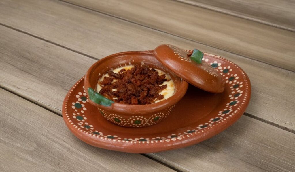 Traditional Mexican Queso Fundido in Clay Dish