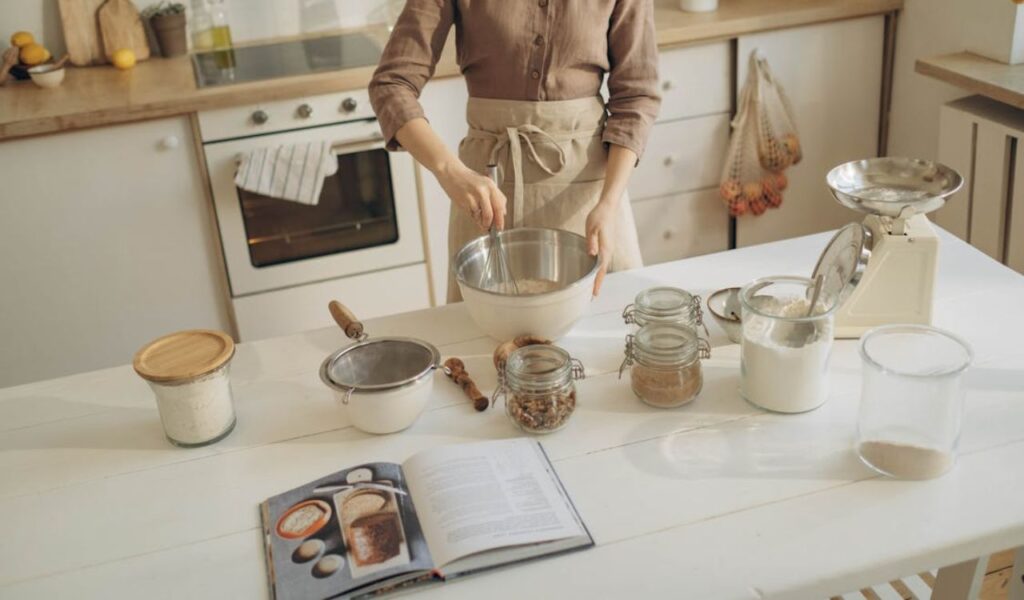 Woman mixing baking ingredients and following recipe