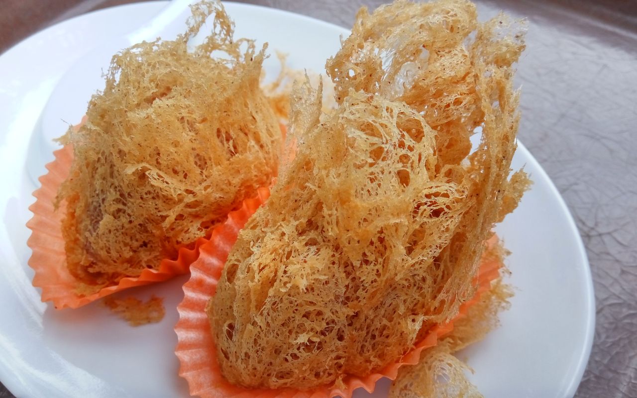 Crispy taro puffs (wu gok) on a plate
