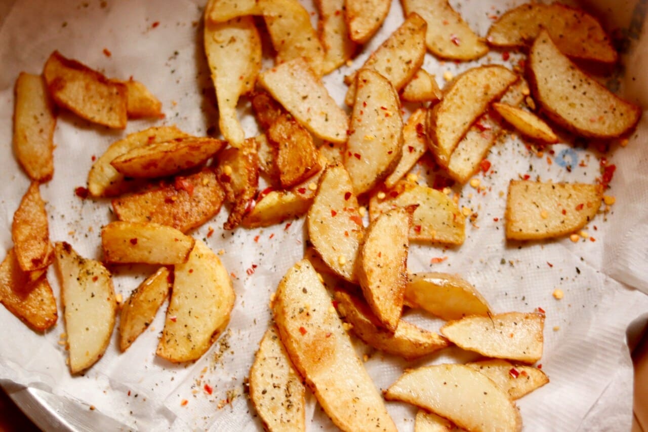 Fried apple slices in a skillet,