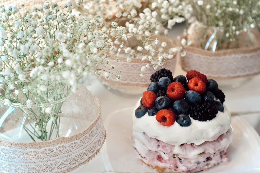 Fluffy angel food cake decorated with fresh berries.