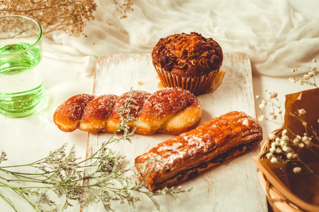counter displaying a mix of pies, cakes, and custards,