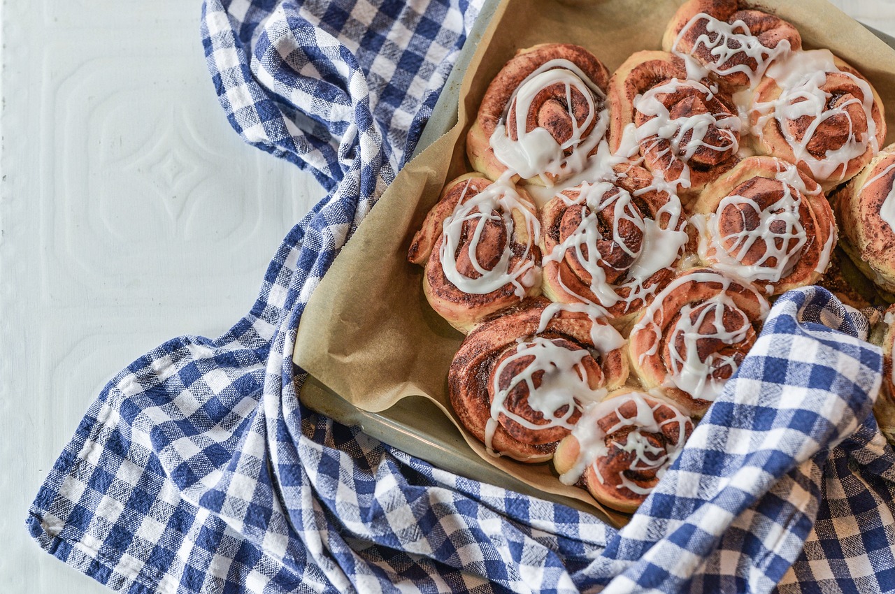 A basket of warm rolls with cinnamon butter.