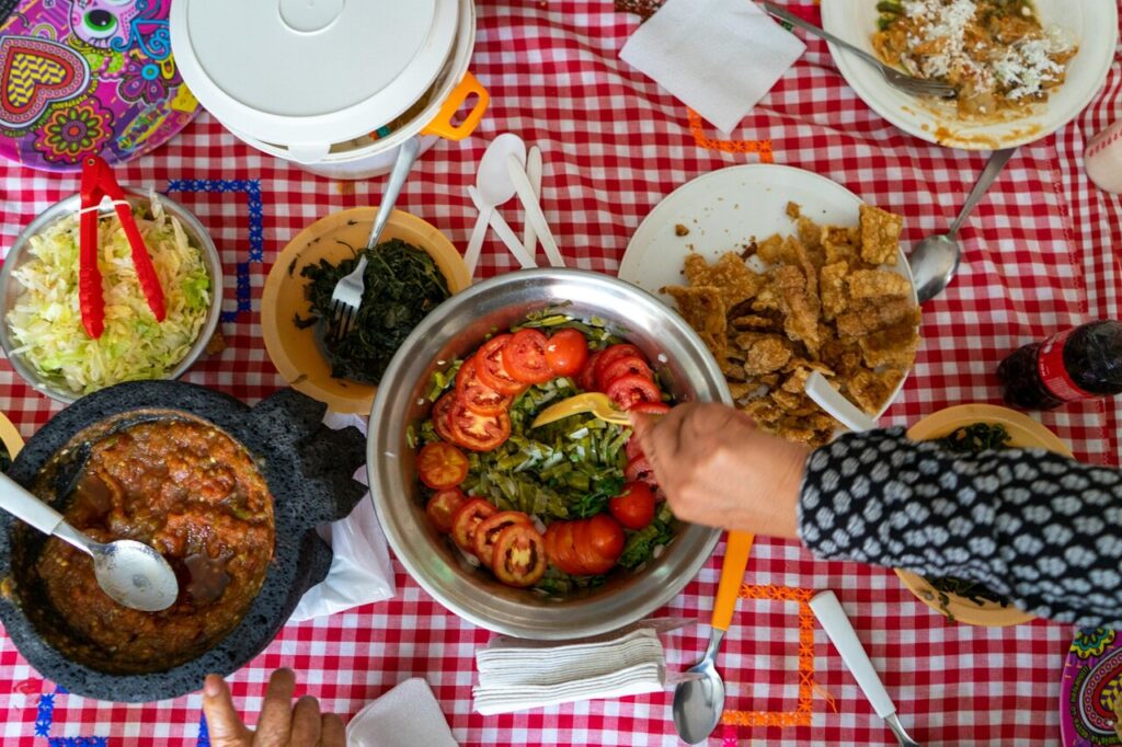 Buffet-style dinner table with mixed containers