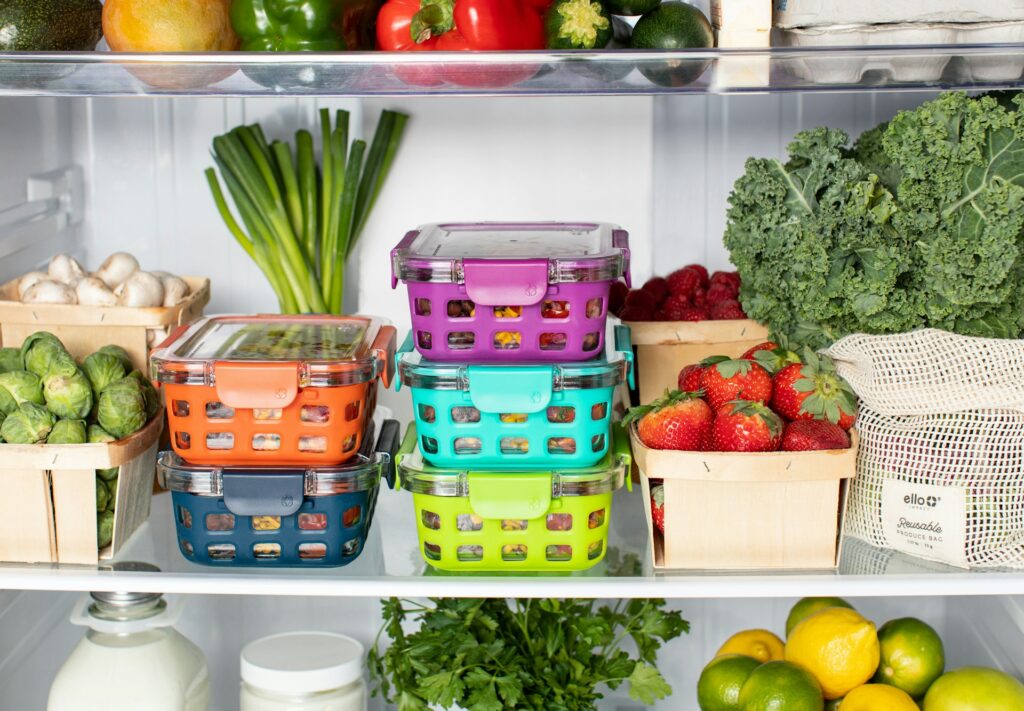 Freezer shelf lined with labeled single-serving containers.


