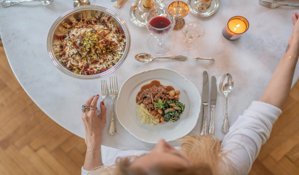 Woman Sitting at Table during Dinner