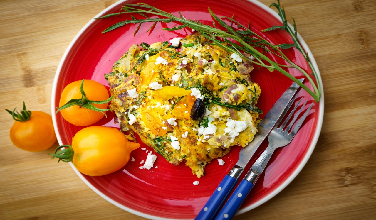 Greek Frittata on Red Ceramic Plate