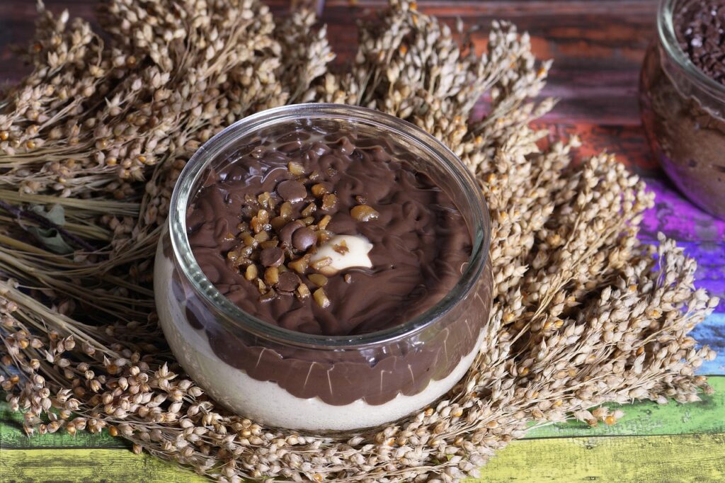 Frosted Nutella mousse in glasses garnished with chocolate shavings.

