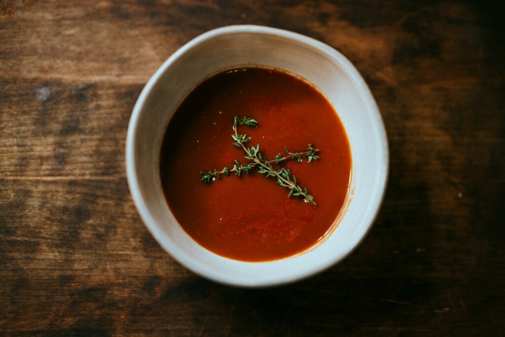 hot soup with herbs on top