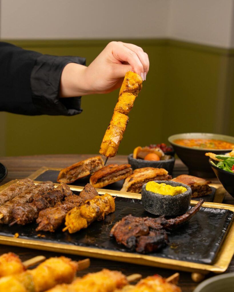 Hand Holding Meat