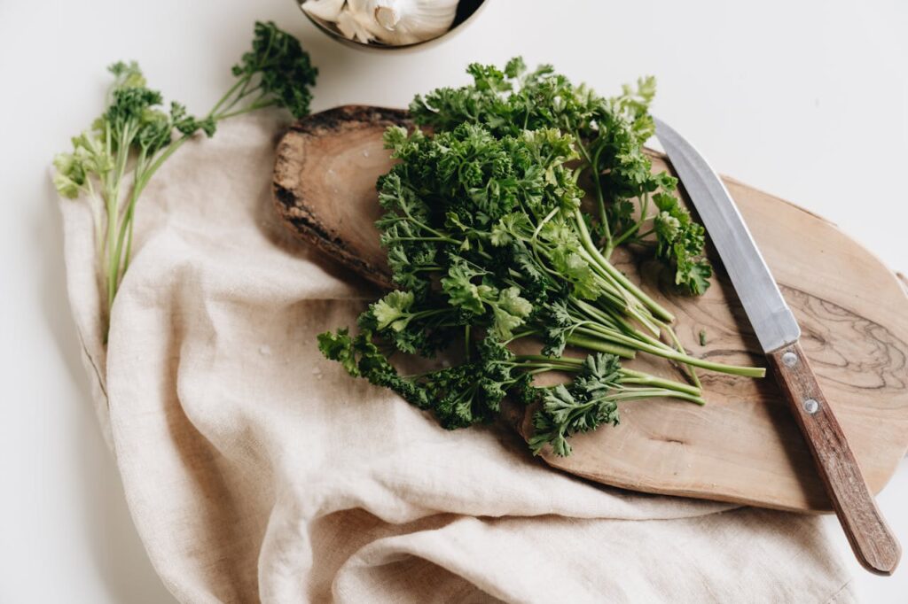 Photo Of Parsley On Top Of Wooden Chopping Board