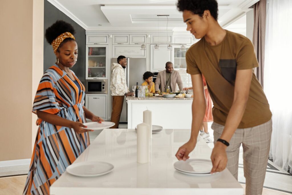 Family Setting the Table for Dinner