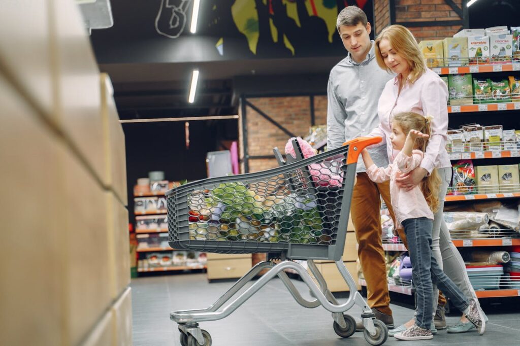 double layered sized shopping carts stacked with a variety of groceries.
