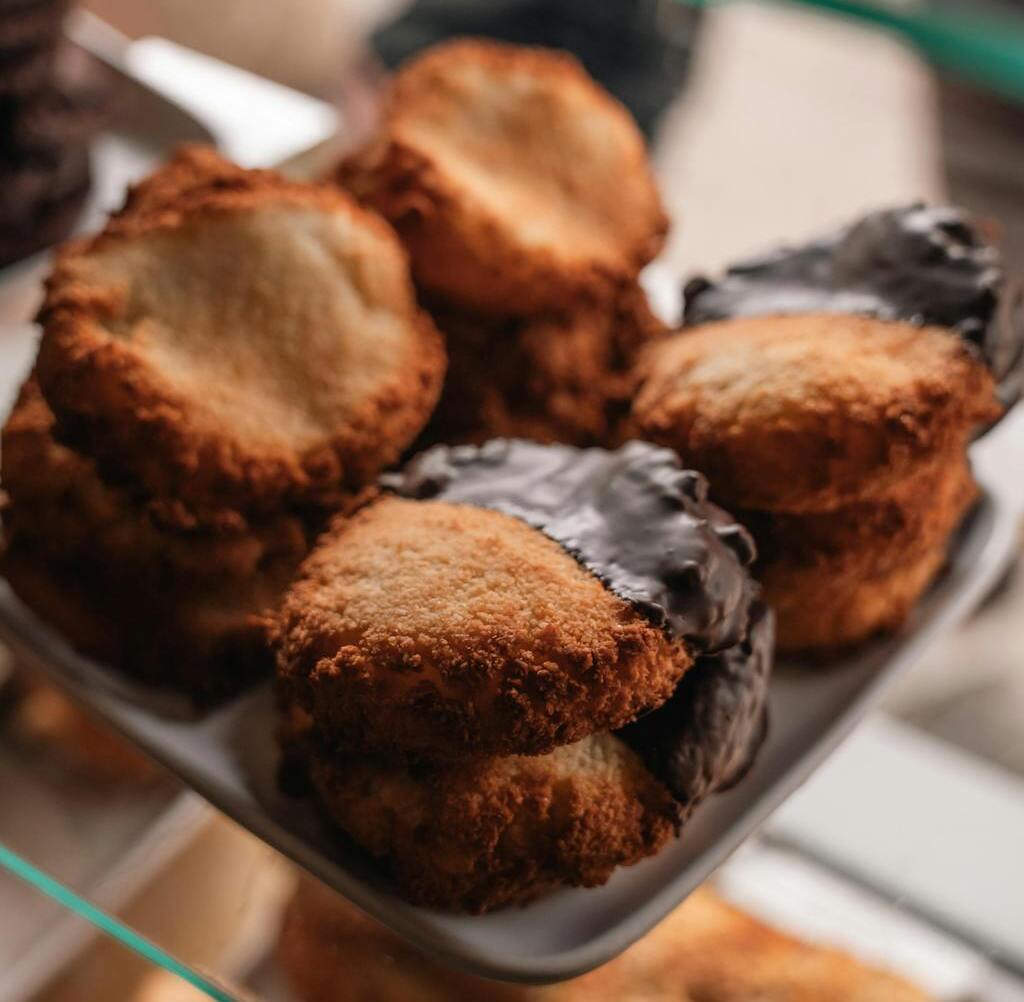 Coconut macaroons dipped in chocolate.