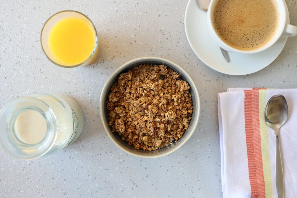 Coffee cup surrounded by healthy whole-grain foods.

