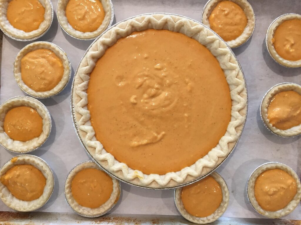 Freshly baked Costco pumpkin pie on a wooden table
