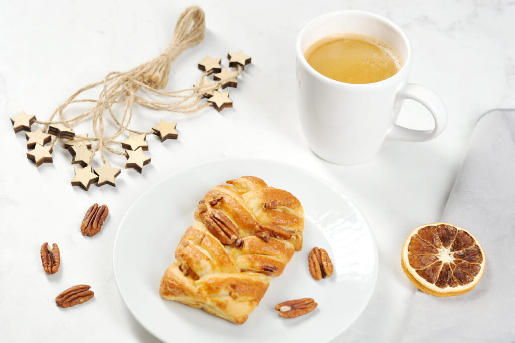 Maple pecan Danish on a breakfast tray with coffee
