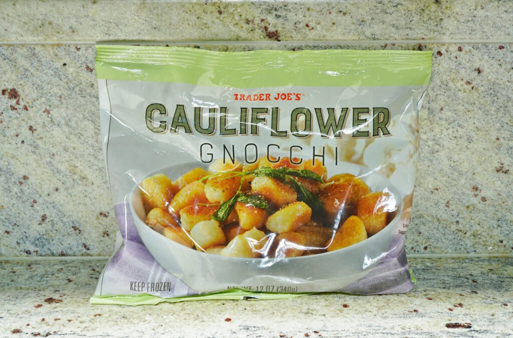 A package of frozen Trader Joe cauliflower gnocchis. Trader Joe is an American specialty grocery store founded by Joe Coulombe.