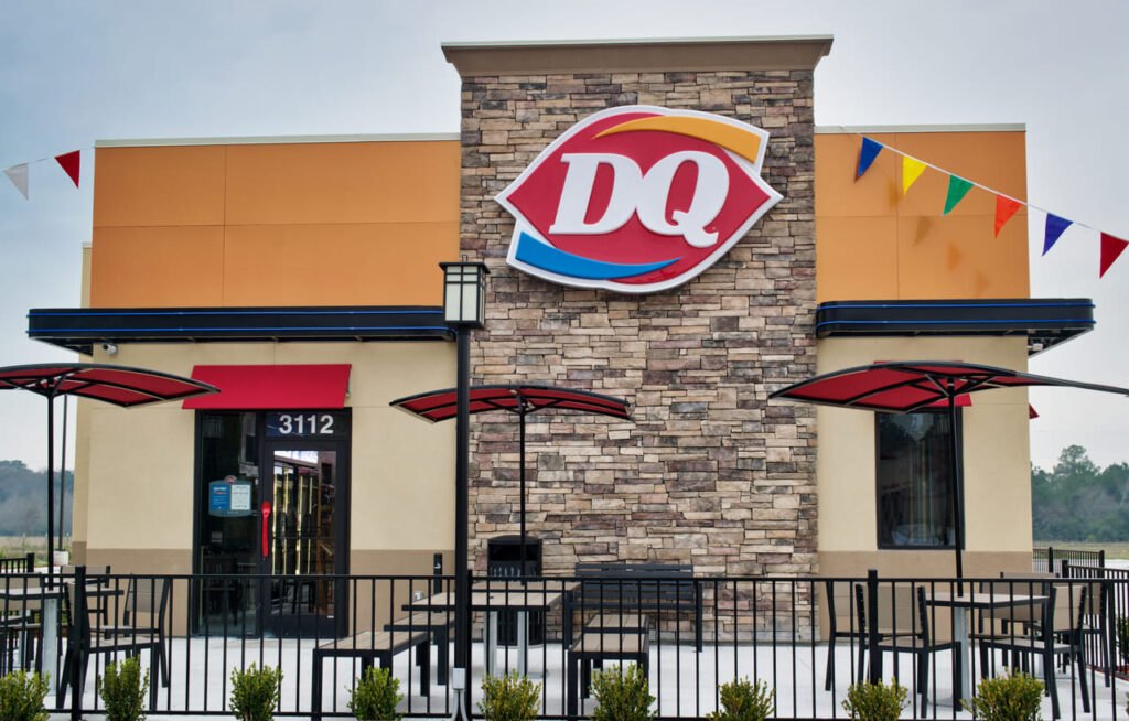 Dairy Queen restaurant entrance exterior in Houston, TX. Fast food chain store selling hot food and ice cream.
