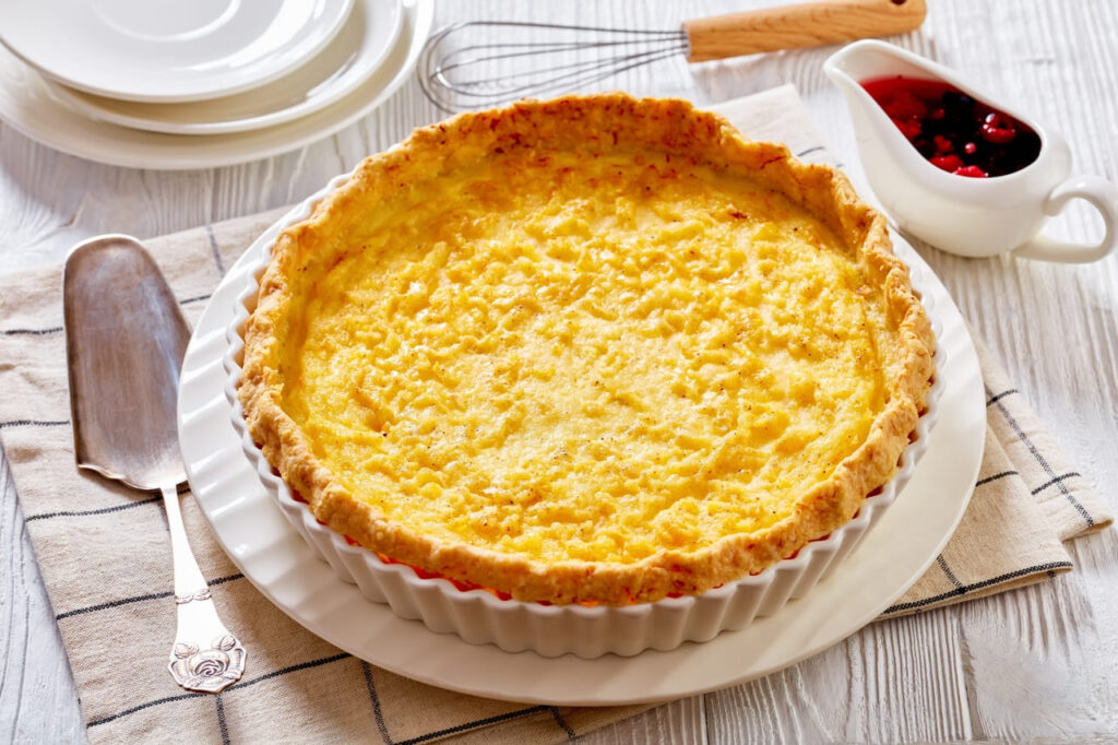 close-up of Classic chess pie pairs a traditional butter pie crust with a sweet, custardy filling in white baking dish, american cuisine,