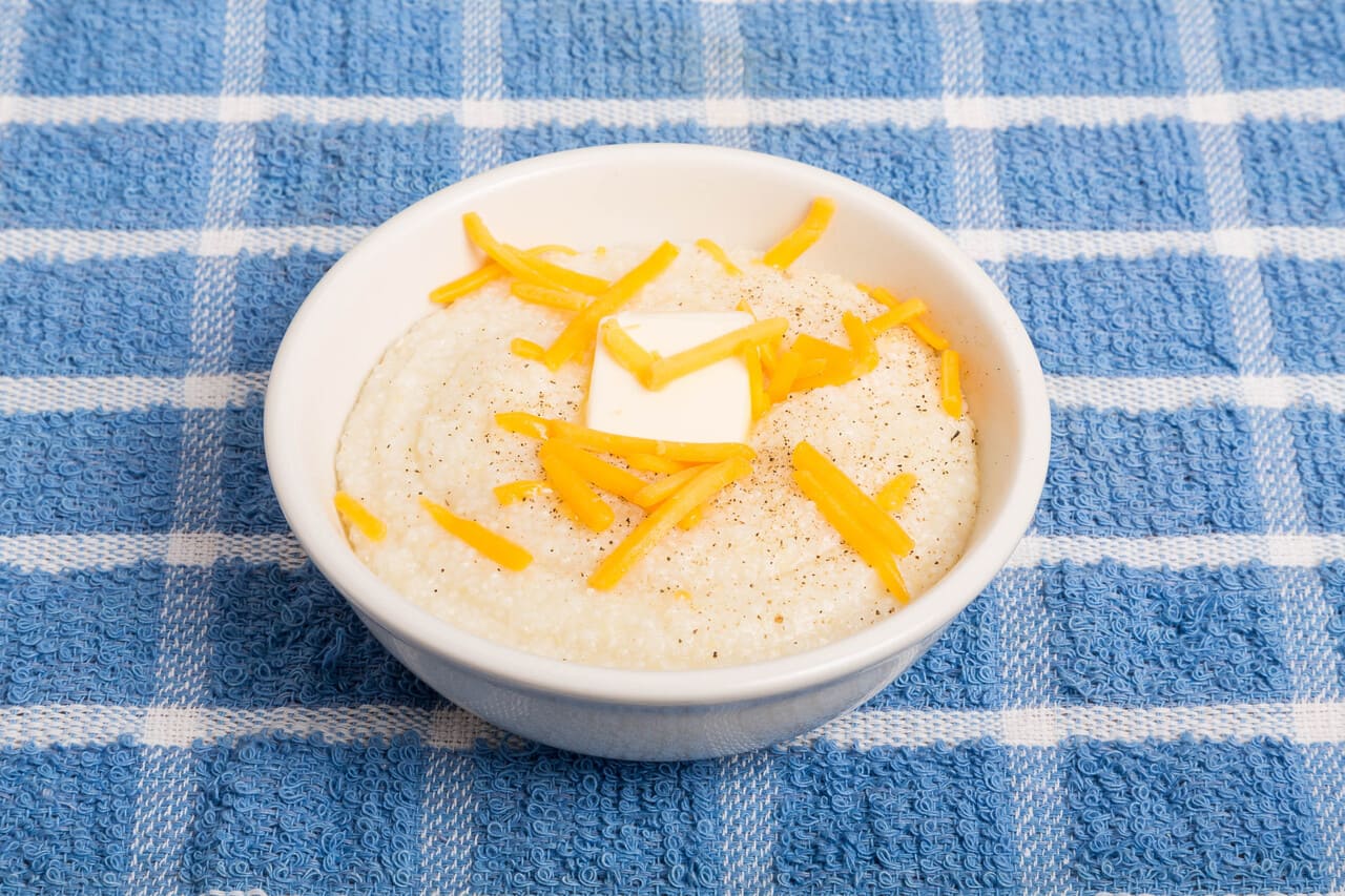 A bowl of hot grits ready to eat