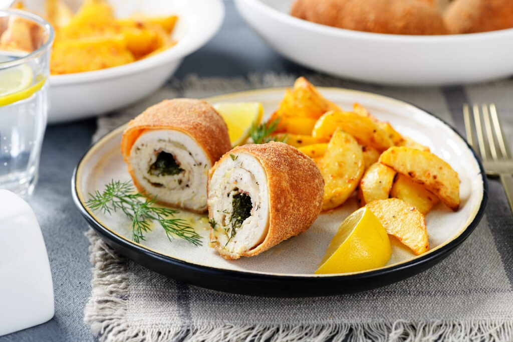 crispy breaded chicken with a hidden center of herbed butter 