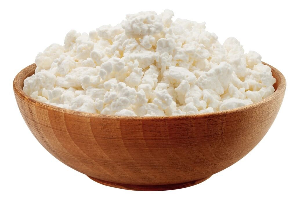 Cottage Cheese, Curd in wooden bowl, isolated on white background, clipping path, full depth of field